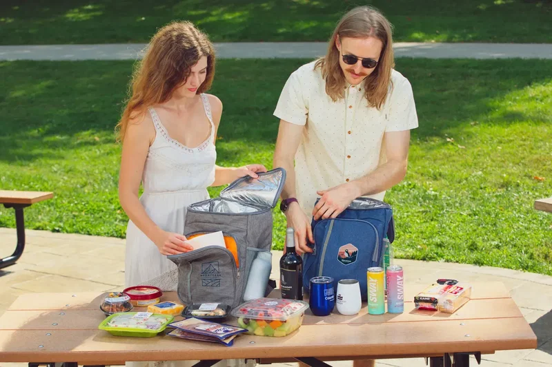 Custom insulated cooler backpack open lid revealing cold-storage main compartment