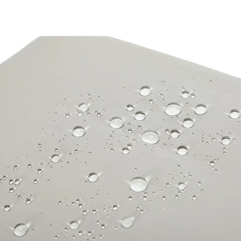 Close-up of the Wrightwood Lunch Cooler Tote's water-resistant nylon fabric beading water droplets