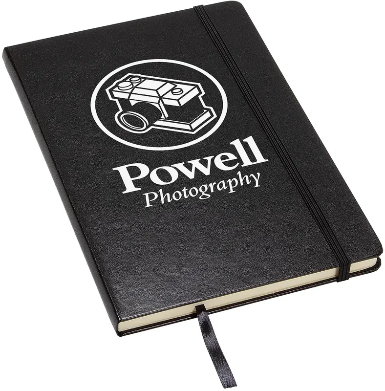 Promotional Zenith laminated journal shown closed with the elastic closure band