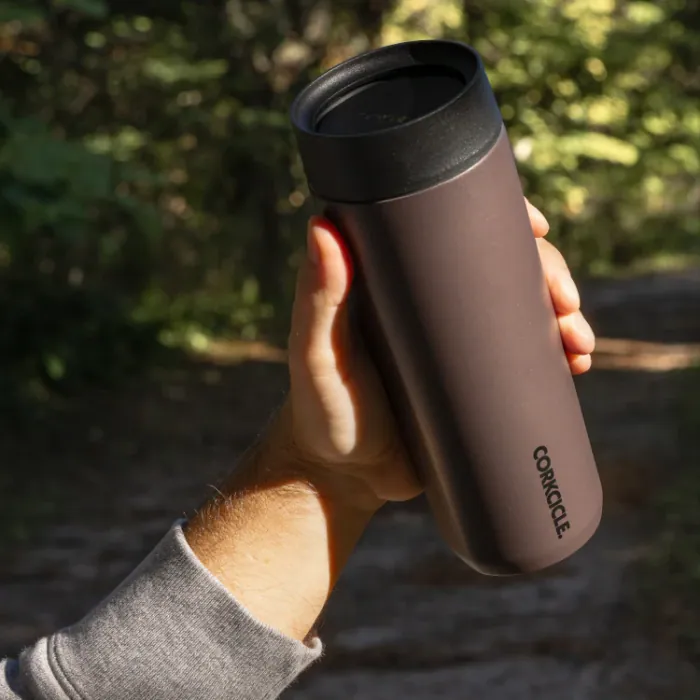 Custom Corkcicle insulated travel mug held outdoors